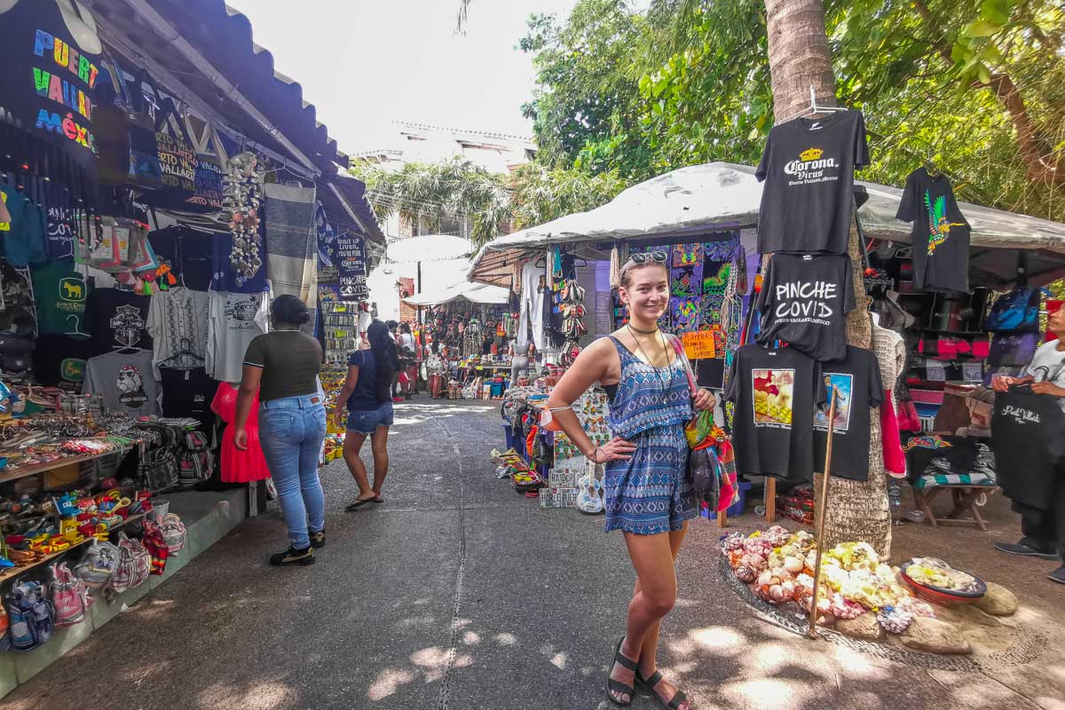A lady poses for a photo while Shopping at Mercado Municipal Rio Cuale in Puerto Vallarta