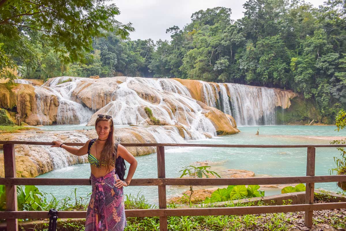 A lady poses for a photo at Agua Azul in Chiapas, Mexico