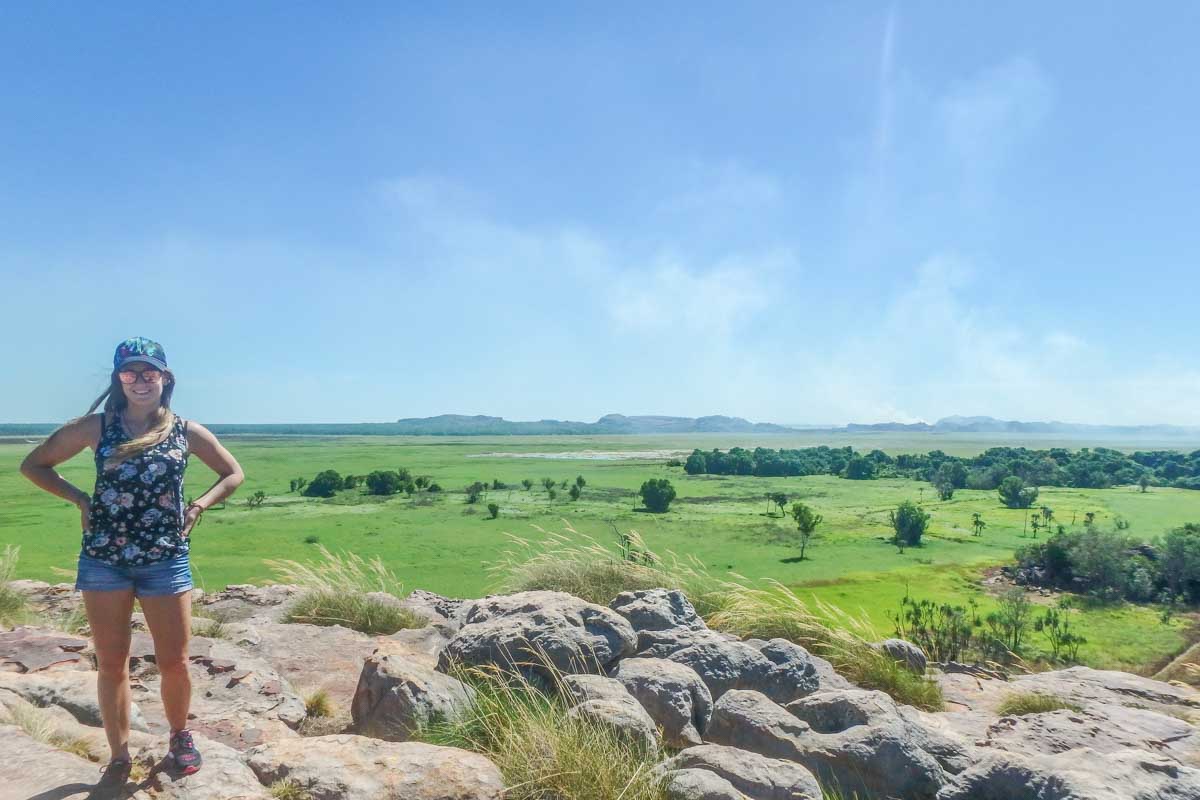 A lady poses for a photo at a viewpoint in Kakadu National Park
