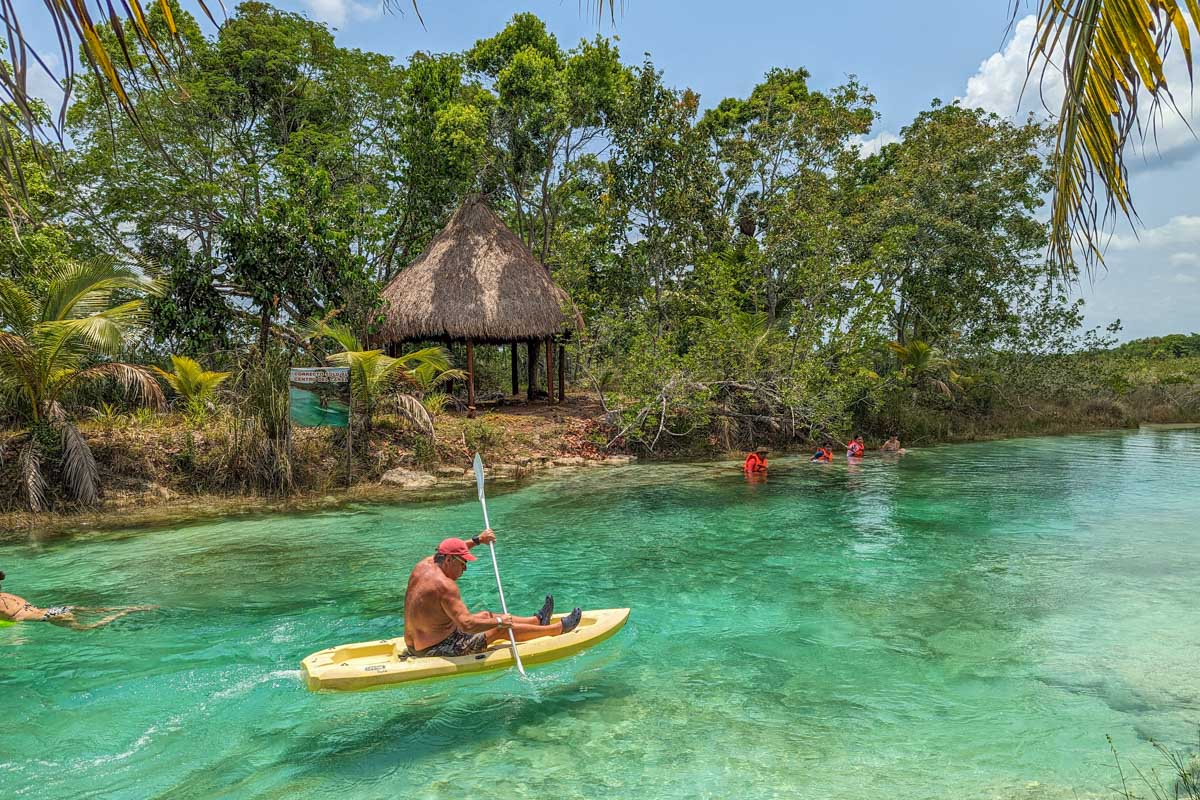 A man kayaks on Lake Bacalar, Mexico