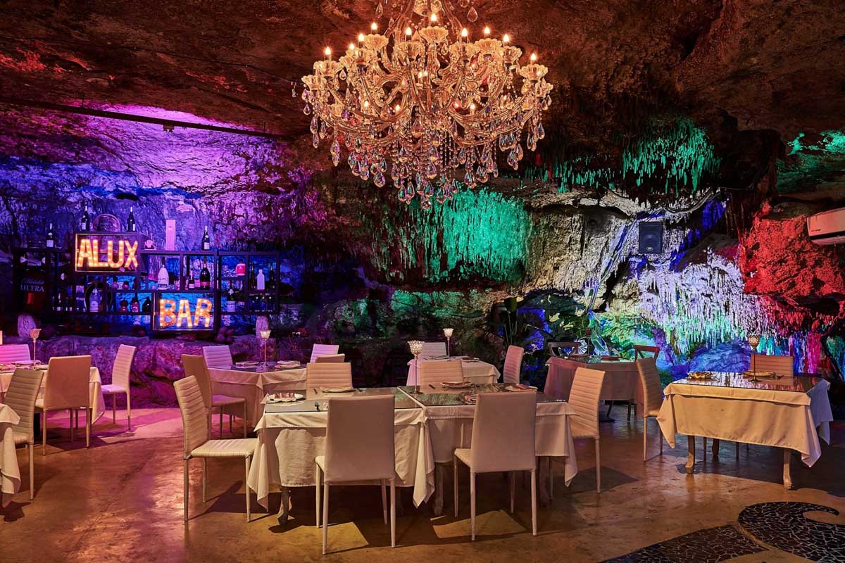 A set table inside Alux Cave Restaurant , Playa del Carmen, Mexico