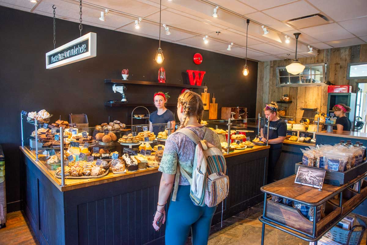 Bailey looks at the food at Purebread in Whistler, BC