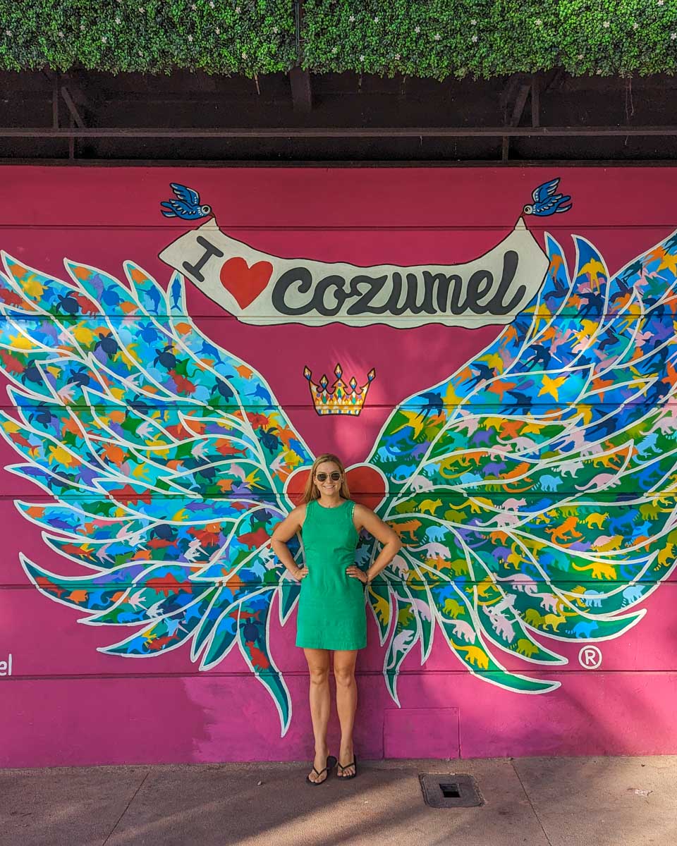 Bailey poses for a photo with the I love Cozumel sign on Cozumel, mexico