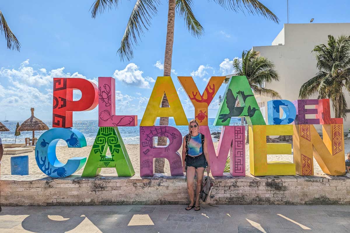 Bailey poses for a photo with the Playa del Carmen sign in Mexico