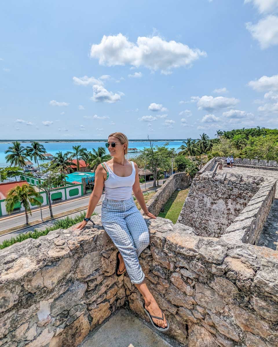 Bailey sits on the wall of Fort San Felipe in Bacalar, Mexico