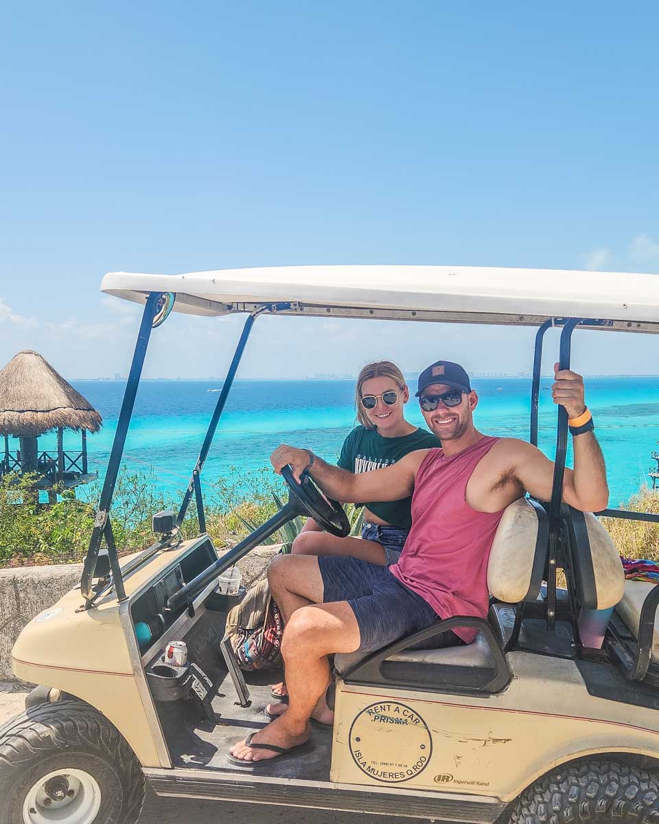 Daniel and Bailey on a golf buggy on Isla Mujeres, Mexico