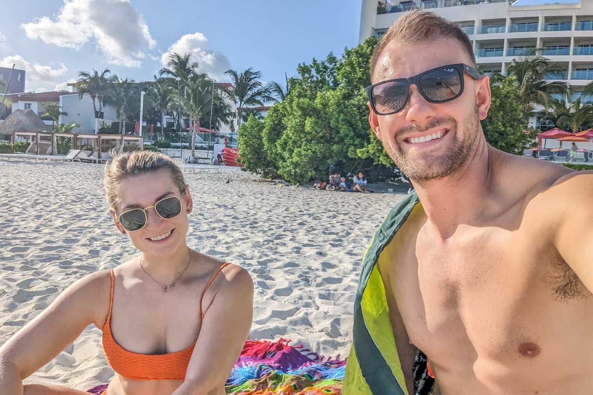 Daniel and Bailey take a selfie on Playa Langosta in Cancun, Mexico