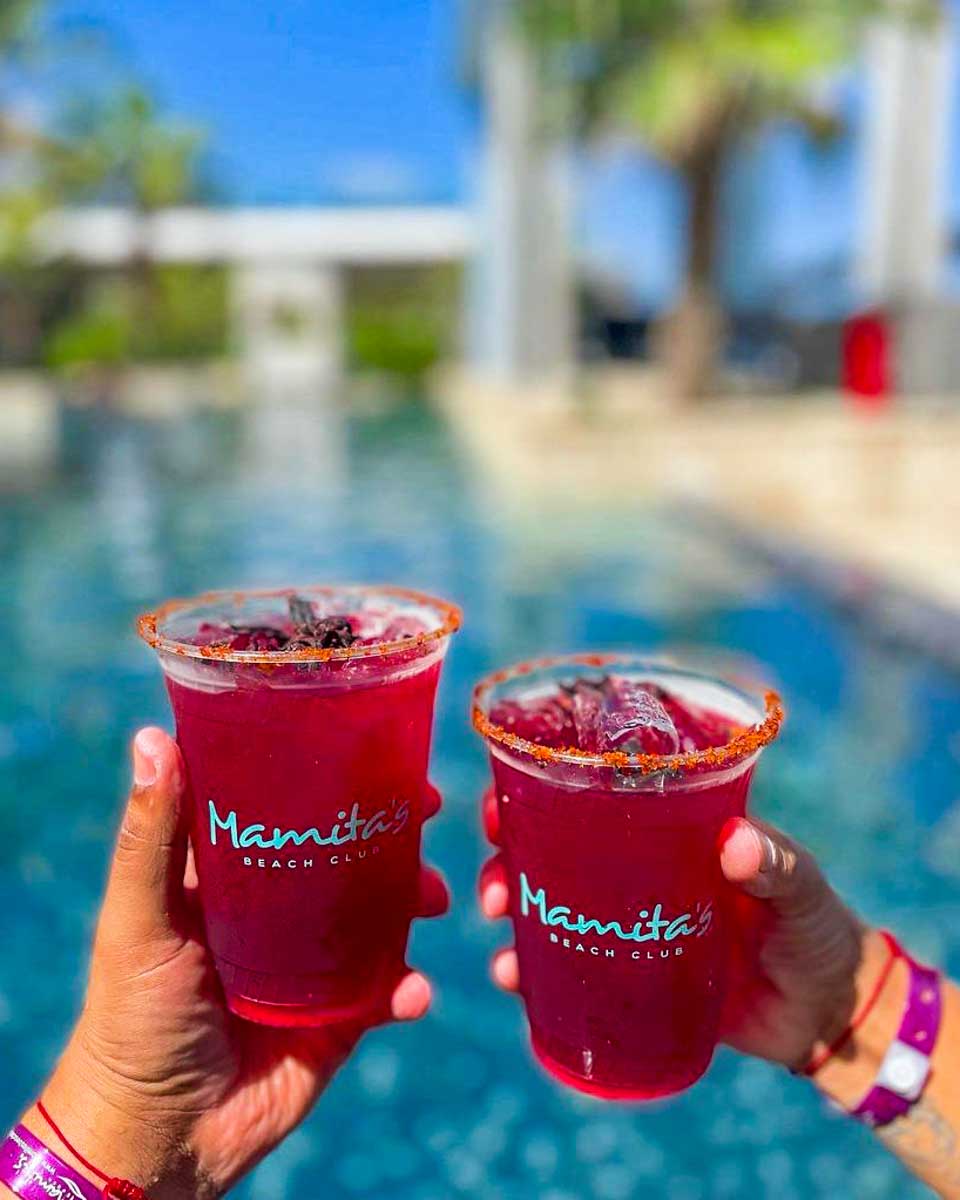 Mamita's Beach Club drinks in hand at the pool