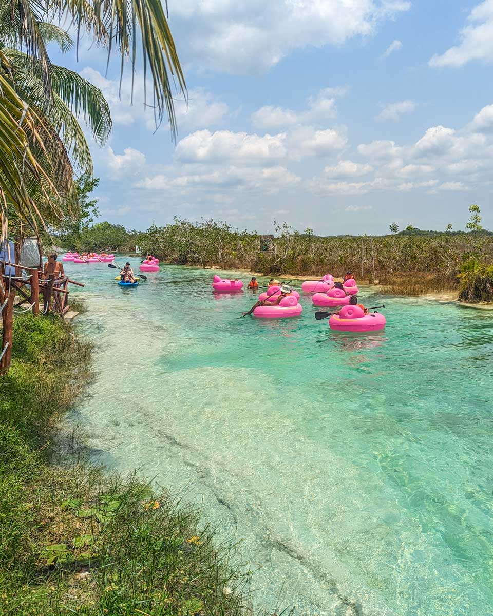 People float down the river at Los Rapidos de Bacalar, Mexico