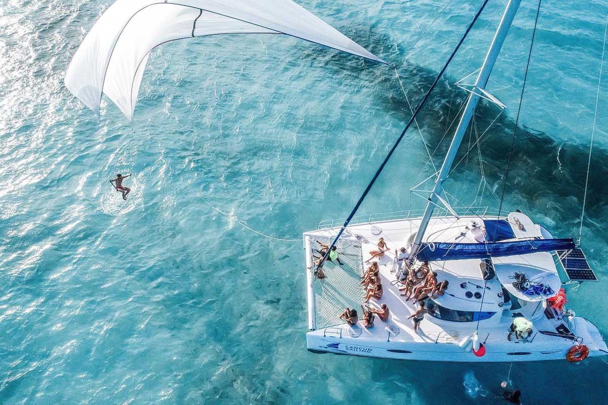 A drone shot of a cruise onboard a catamaran in Playa del Carmen, Mexico