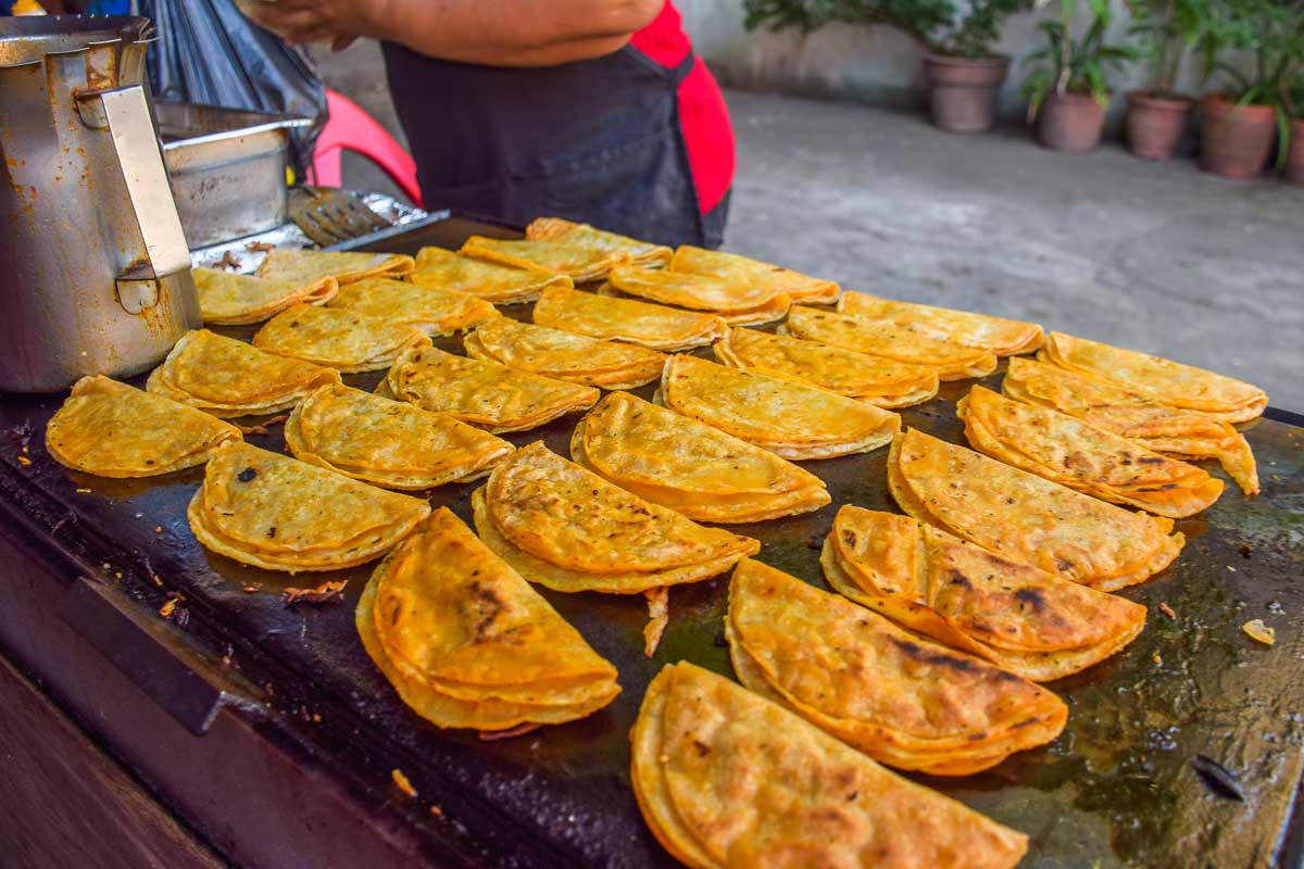 Tacos cooking on a food tour in Playa del Carmen