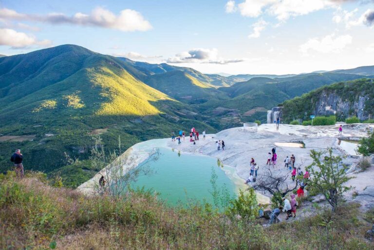 a tour group relaxes at the top of Hierve el Aqua in Oaxaca