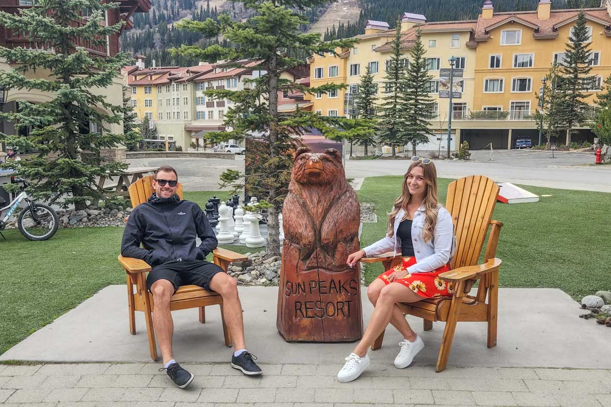 Bailey and Daniel take a photo at Sun Peaks Resort in Summer