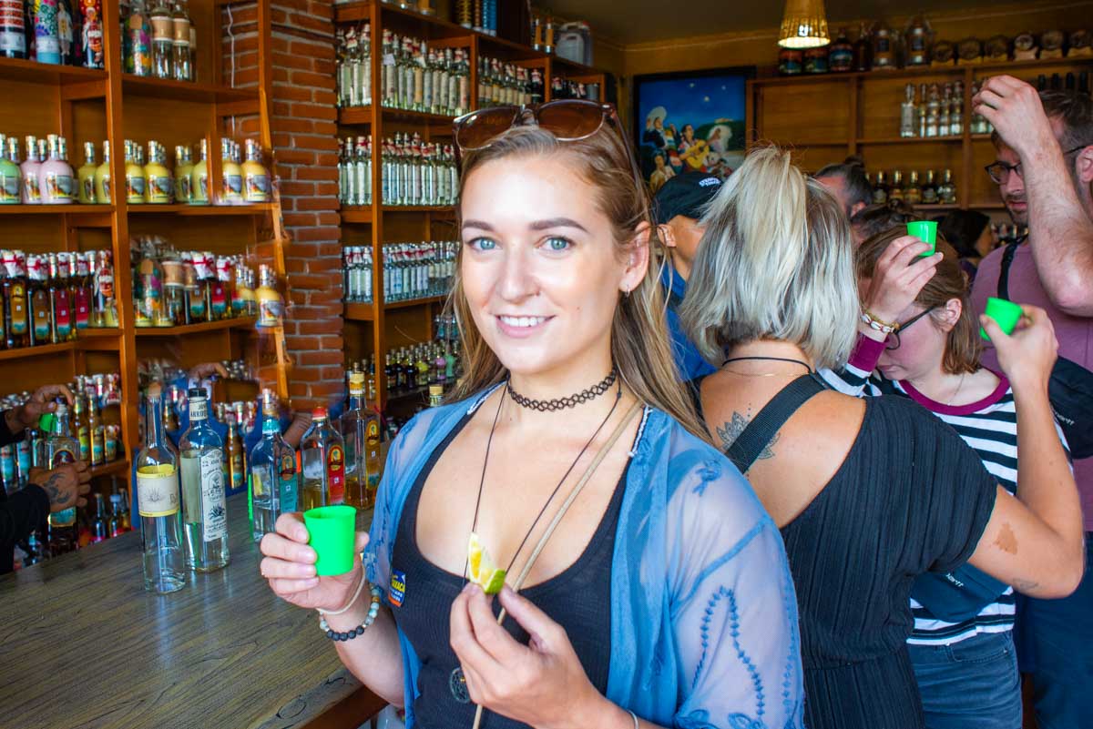 Bailey from Destinationless Travel at a tequila tasting in Cabo San Lucas