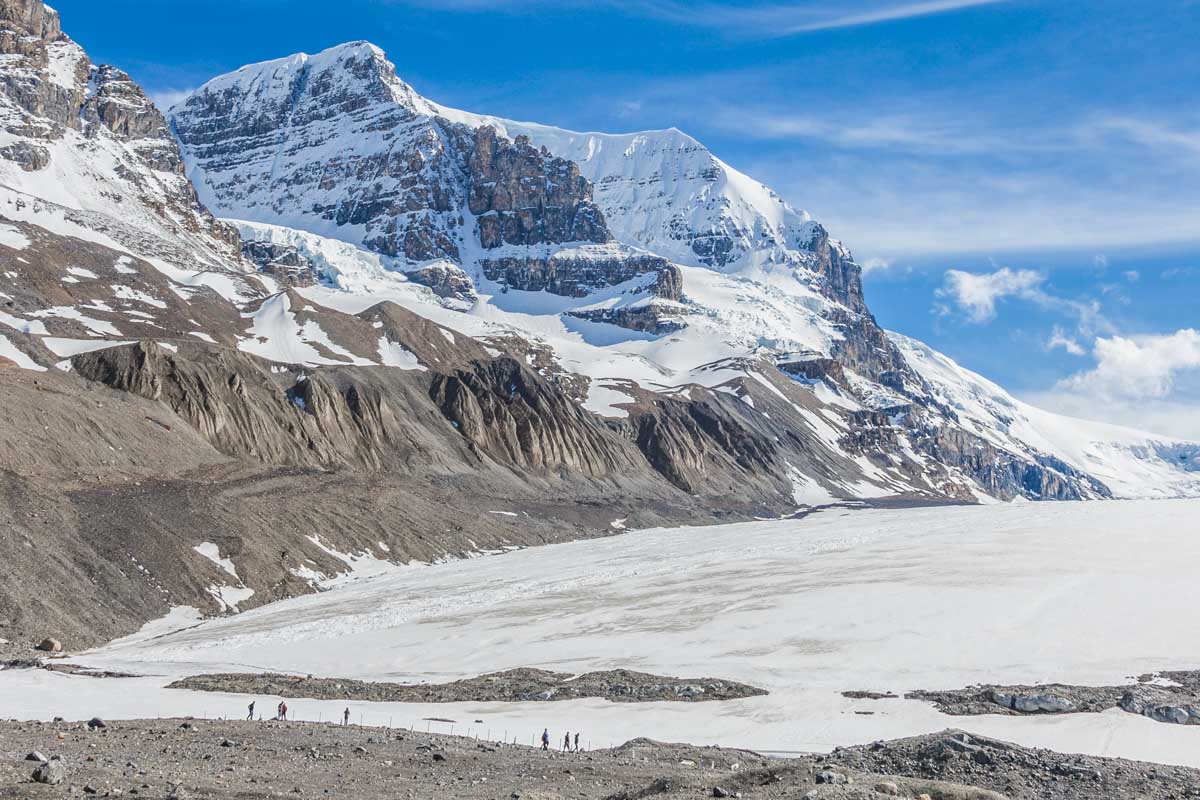 Hikers walk on the Athabasca Glacier Trail to the viewpoint of the glacier and Columbia Icefield