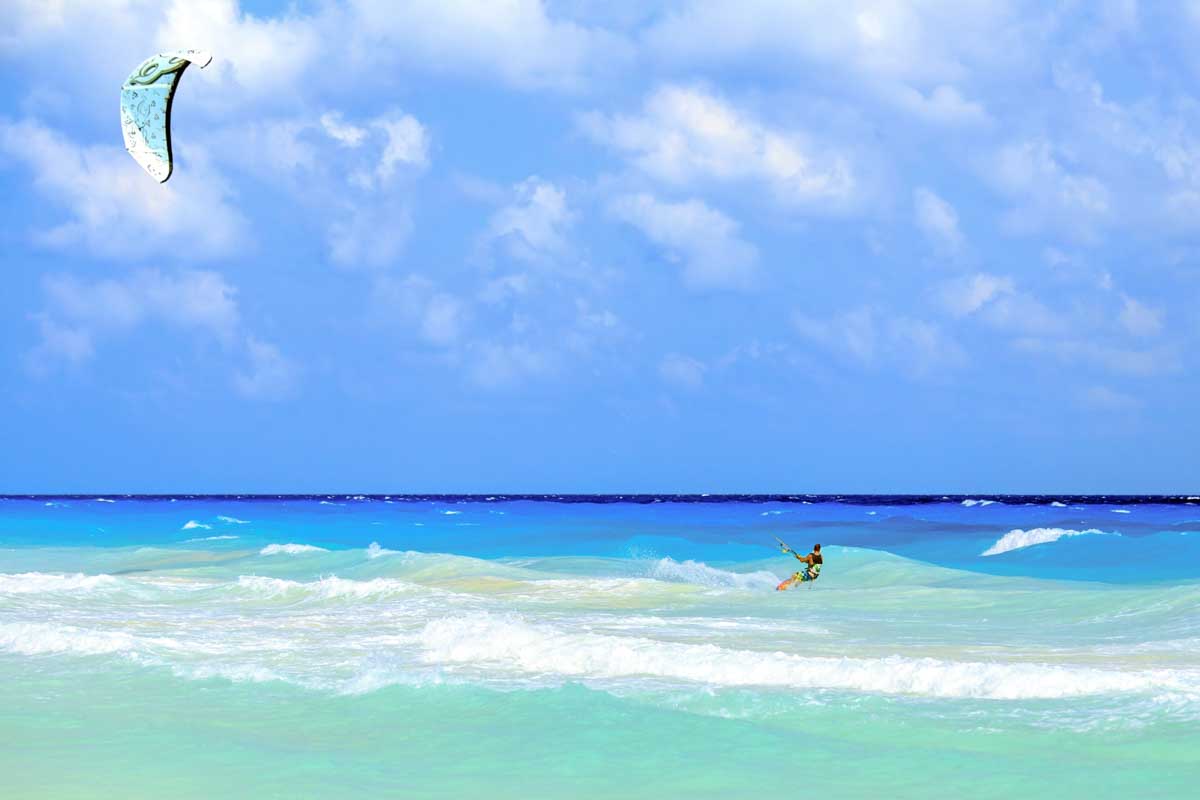 A man kitesurfing on Isla Holbox, Mexico