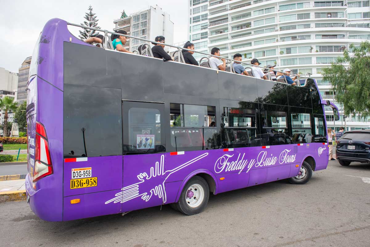 An open air bus in Lima city carrying tourists