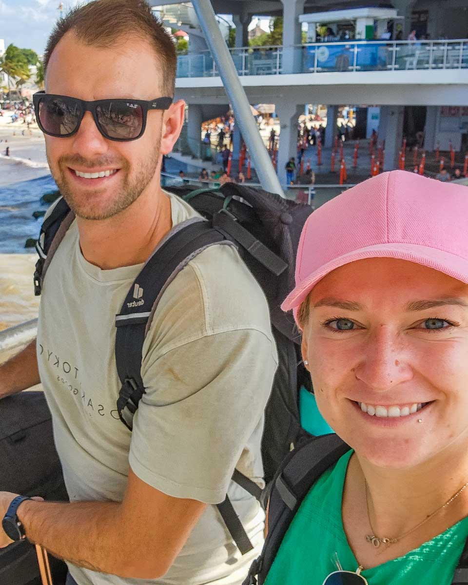 Bailey and Daniel take a selfie while pushing their suitcases to the ferry on their way to Cozumel, Mexico
