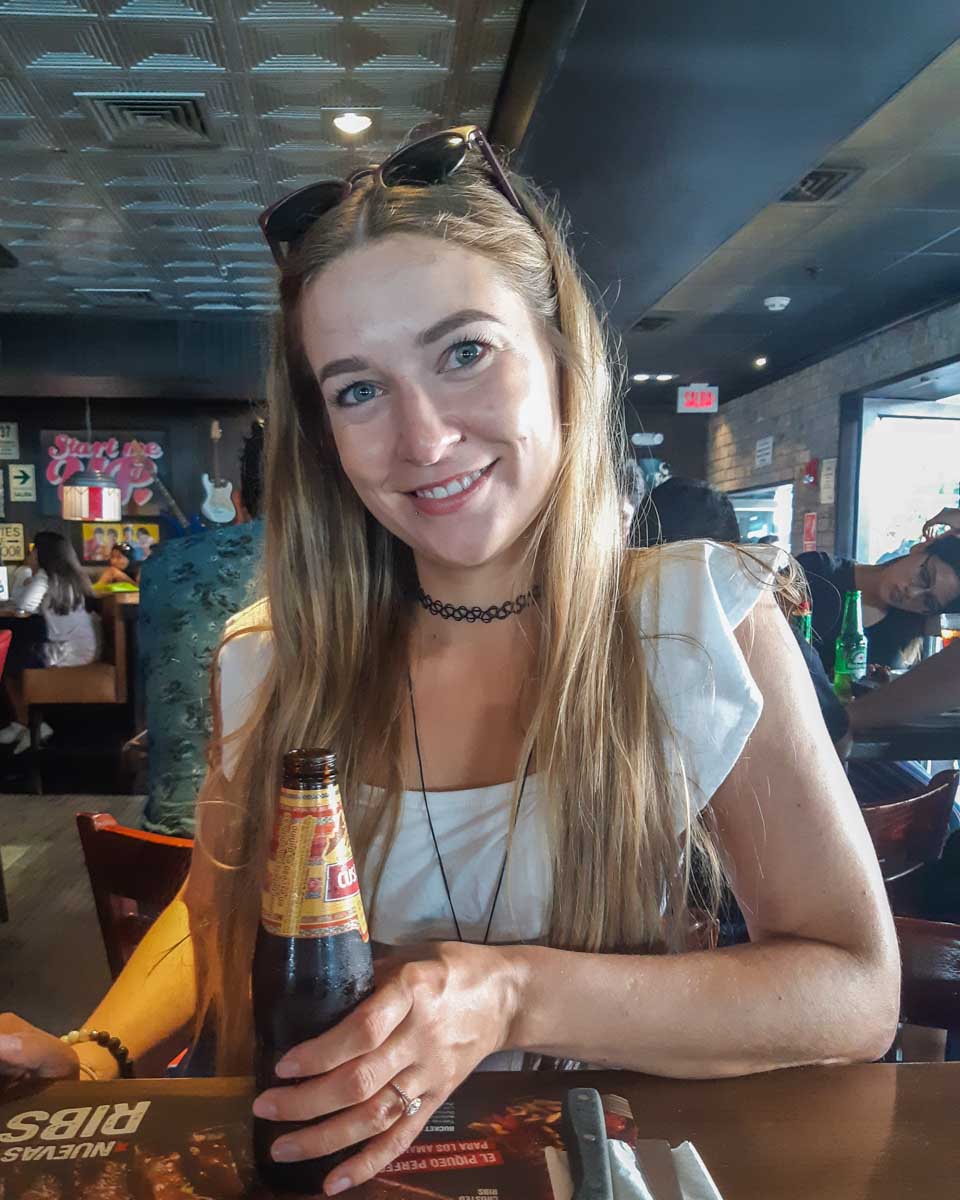 Bailey enjoys a drink on Calle Berlin in Lima, Peru