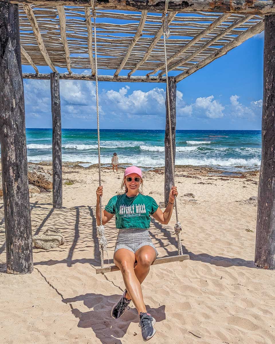 Bailey relaxes on a swing in Punta Sur Eco Beach Park, Cozumel