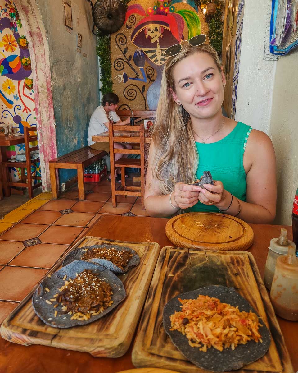 Bailey with her tacos at Guisados on Cozumel, mexico