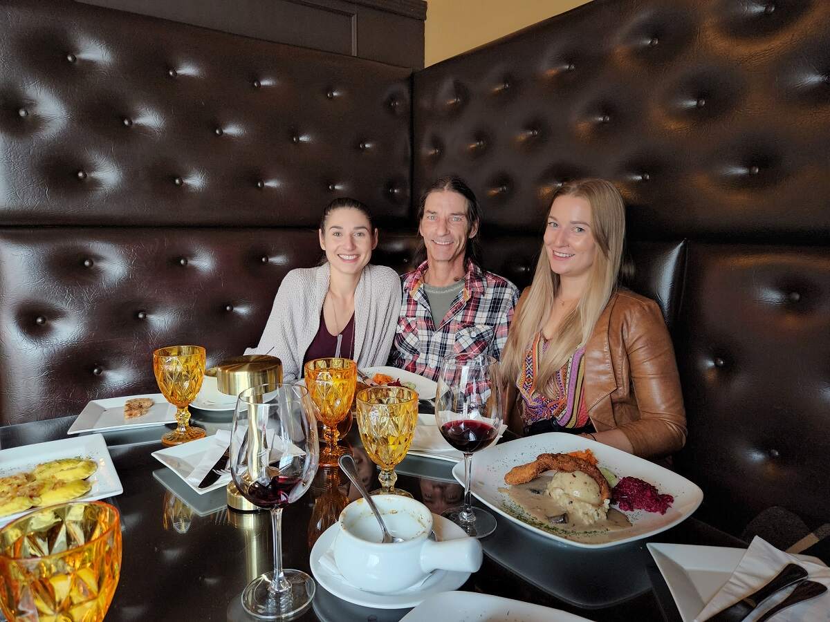 three people in a booth at Continental Fine Treat Bistro in Edmonton