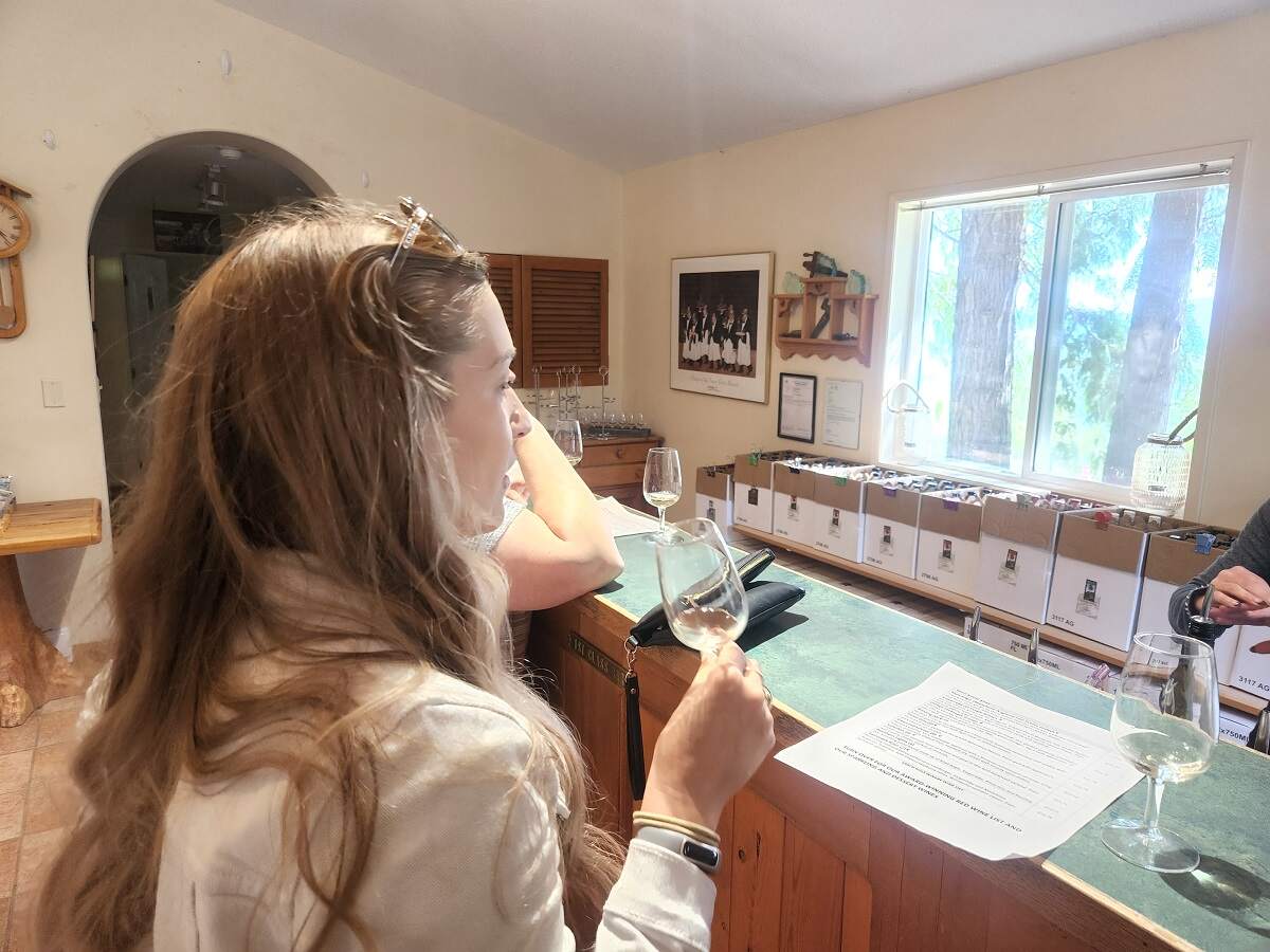 womean tasting wine at Larch Hills