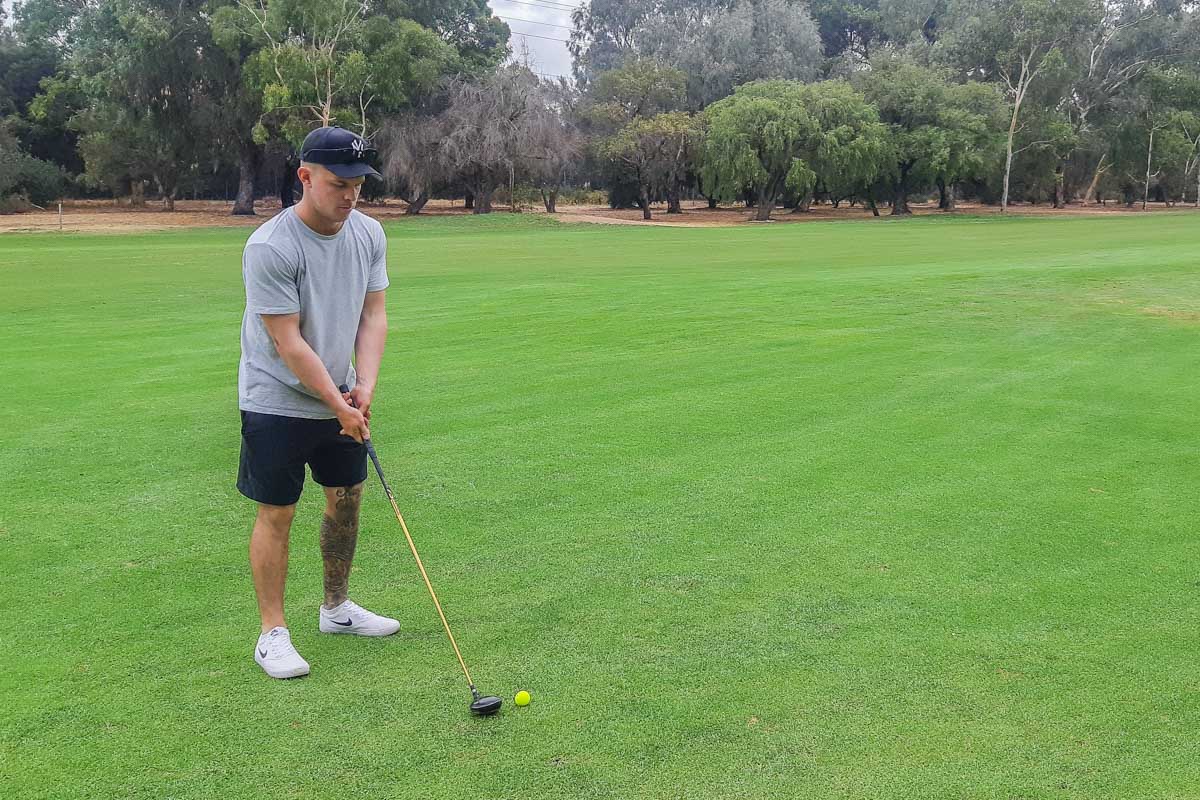 A man plays golf in Australia