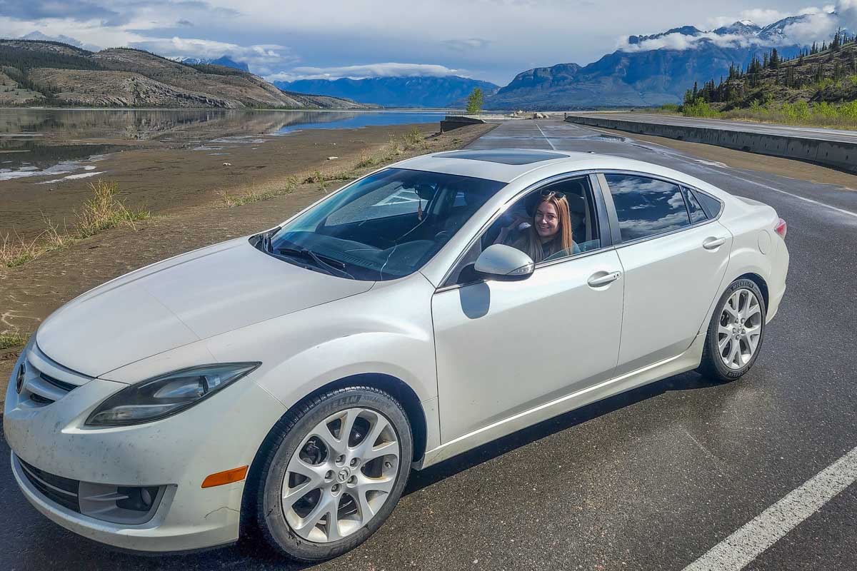 woman in a car on the road near jasper
