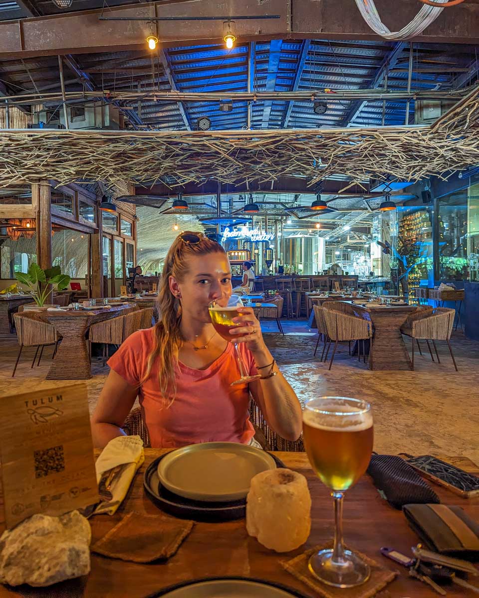 Bailey sips a beer at Cerveciria Tulum, Mexico