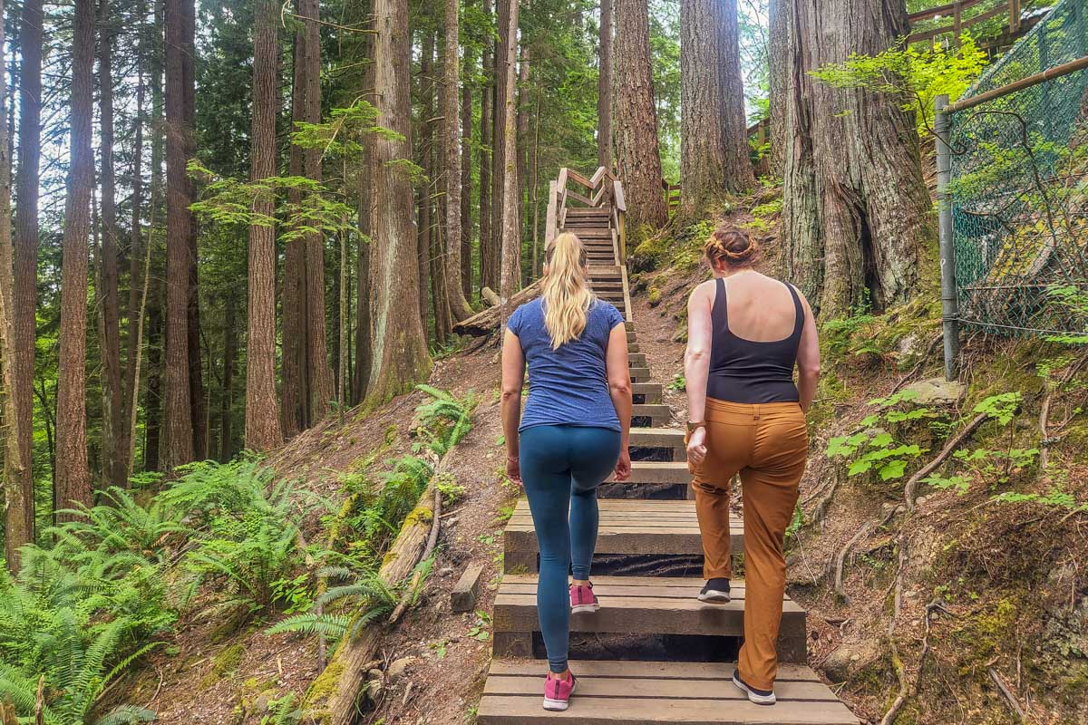Bailey and her friend walk along a trail in Lynn Canyon