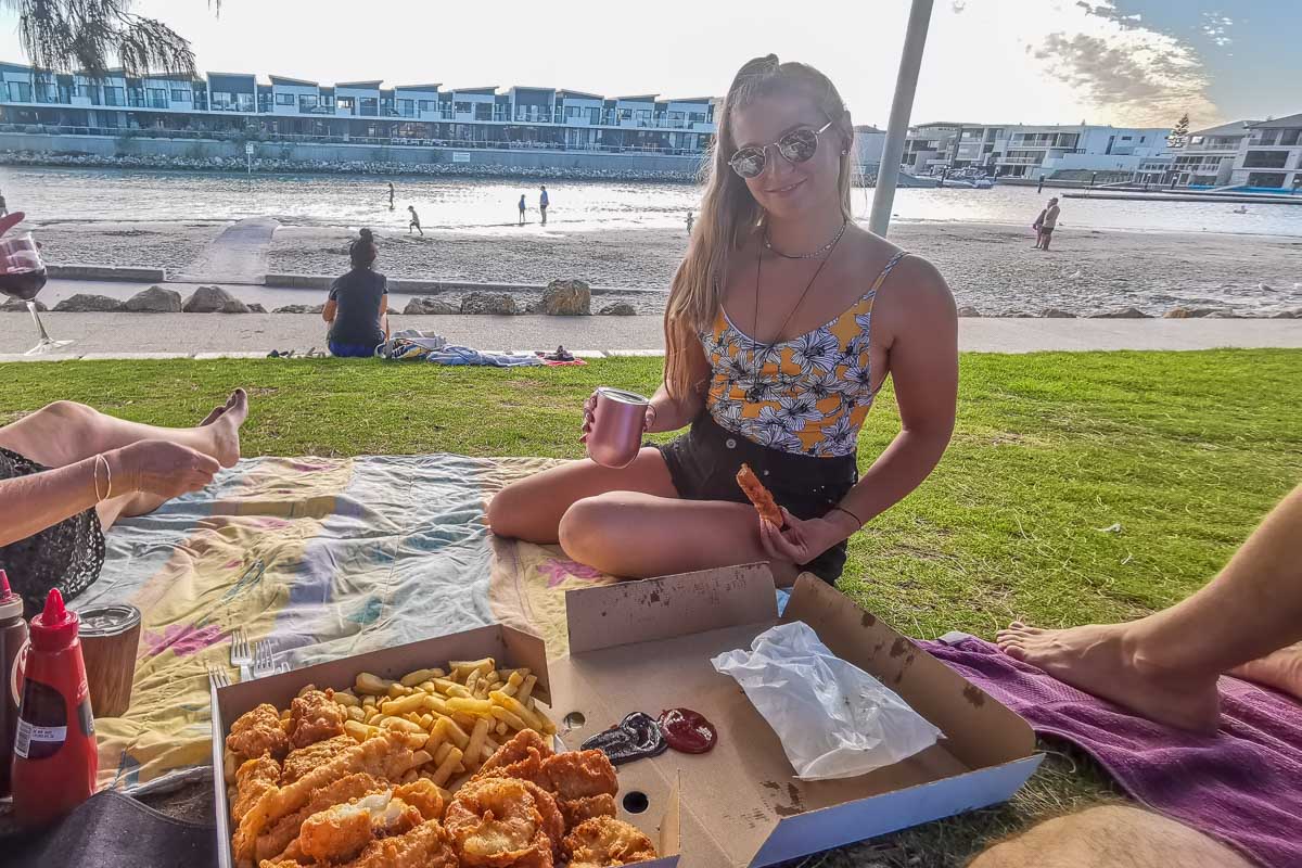 Bailey enjoys fish and chips at Coogee Beach, Perth