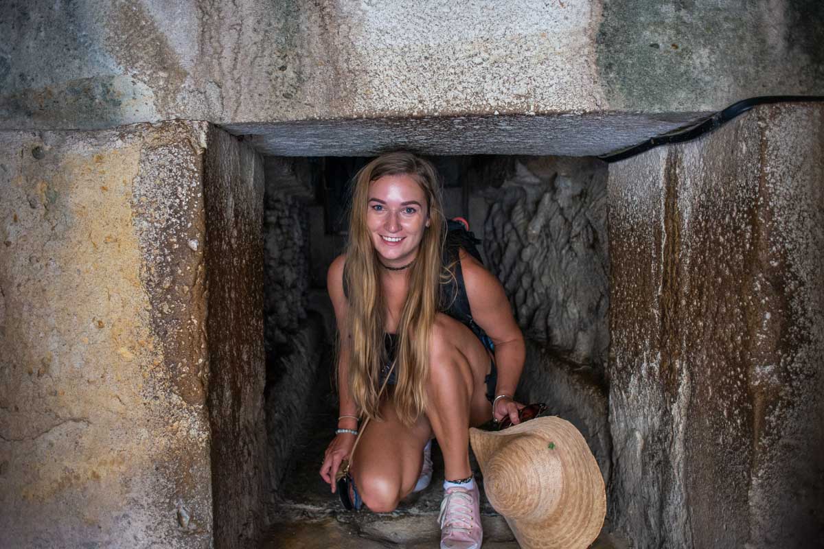 Bailey in a tunnel at the Mitla Ruins on a tour to Hierve El Agau