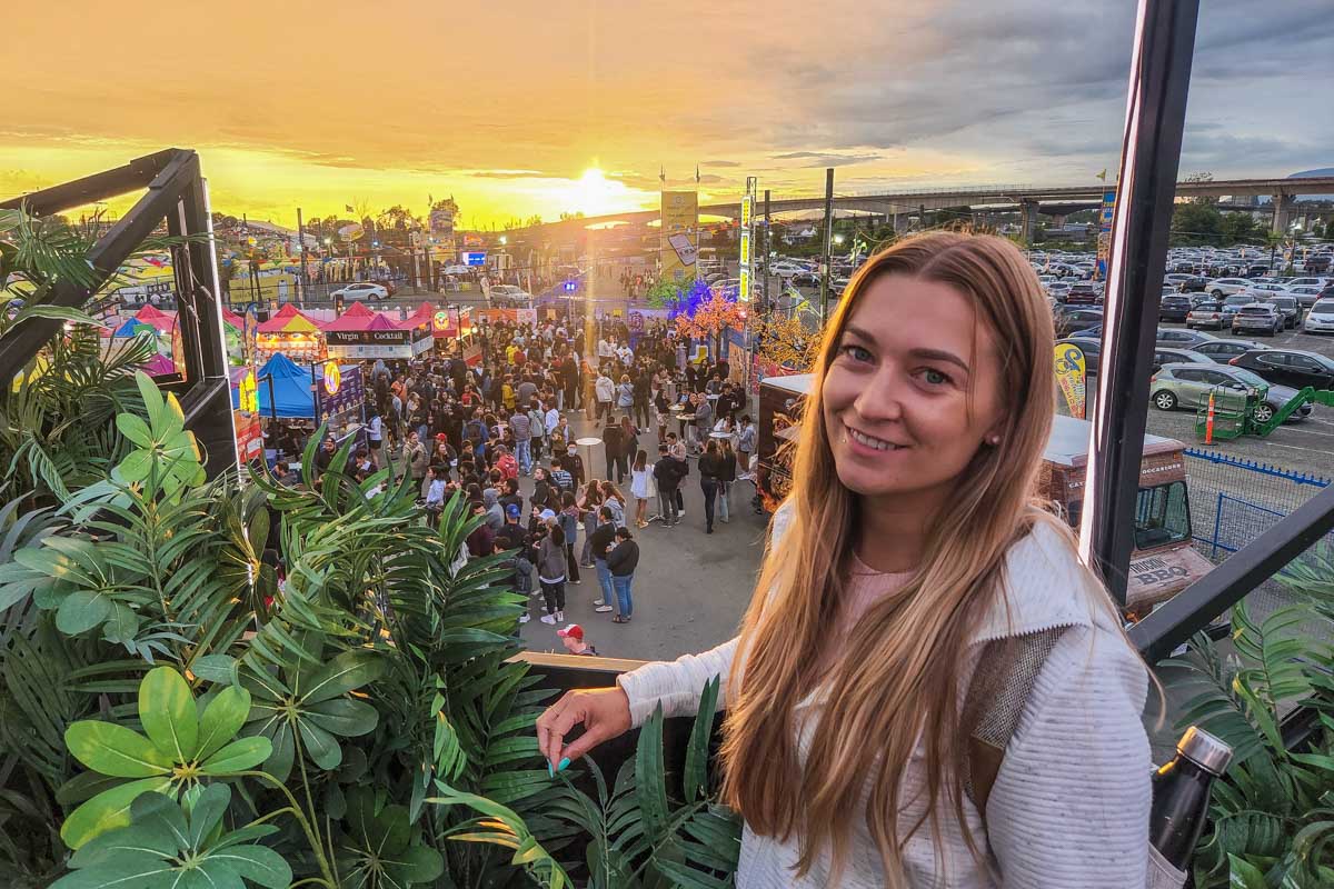 Bailey looks over at the Richmond Night Market at sunset
