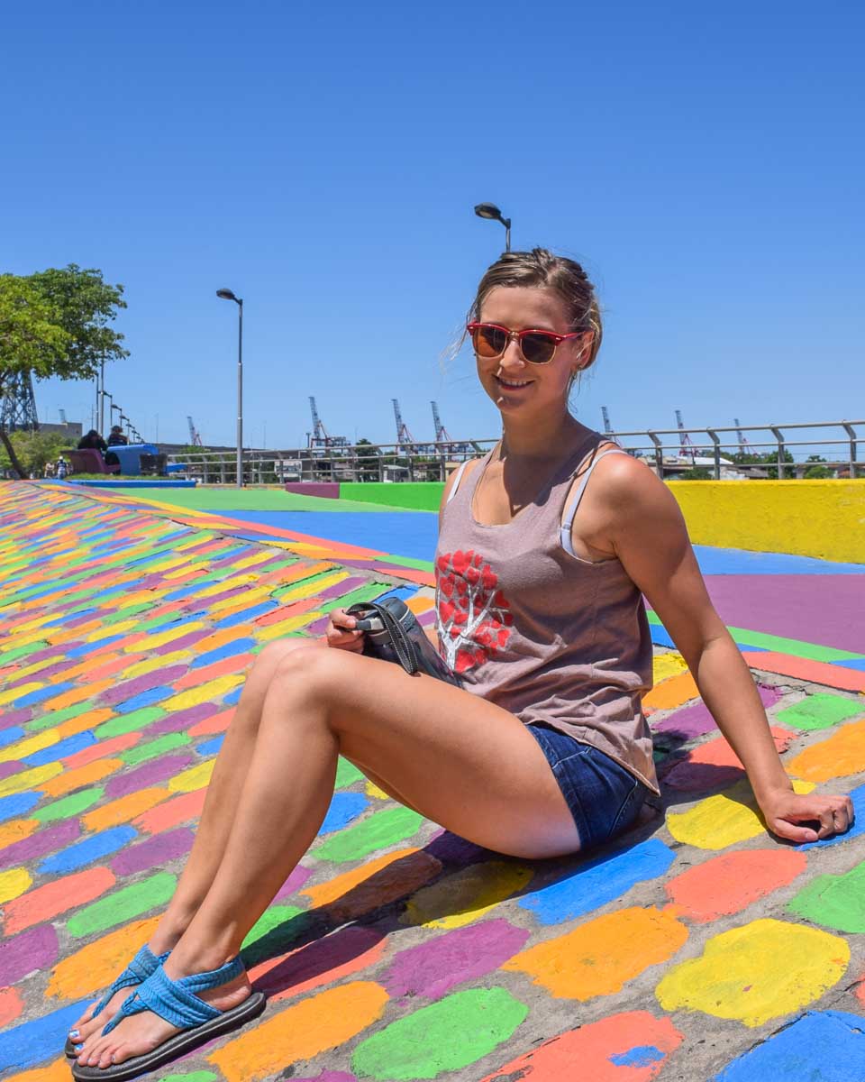 Bailey sits on the colorful streets of La Boca, Buenos Aires