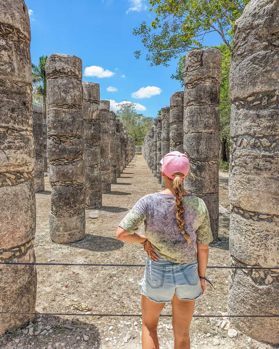 Bailey stands at the Group of the Thousand Columns which is part of the Temple of the Warriors at Chichen Itza