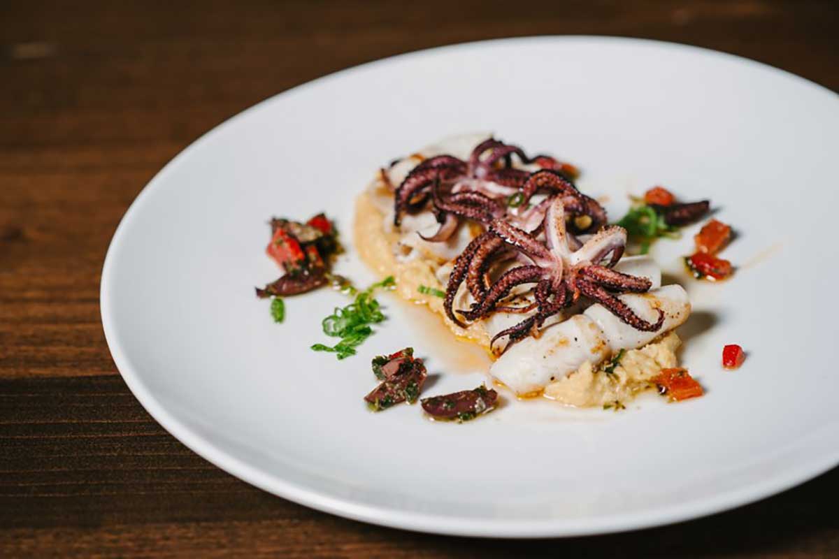 Calamari appetizer with lemon hummus at Rimrock Cafe in Whistler, BC, Canada