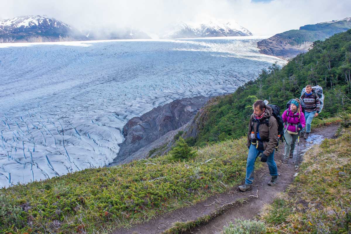 Hikers walk along Glacier Grey in Torres del Paine NP