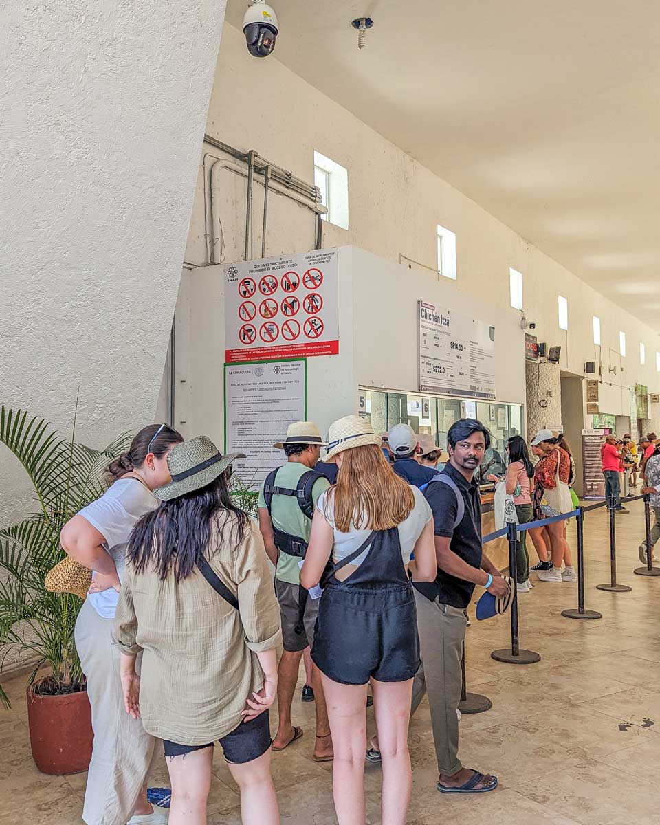People line up to buy tickets to Chichen Itza, Mexico
