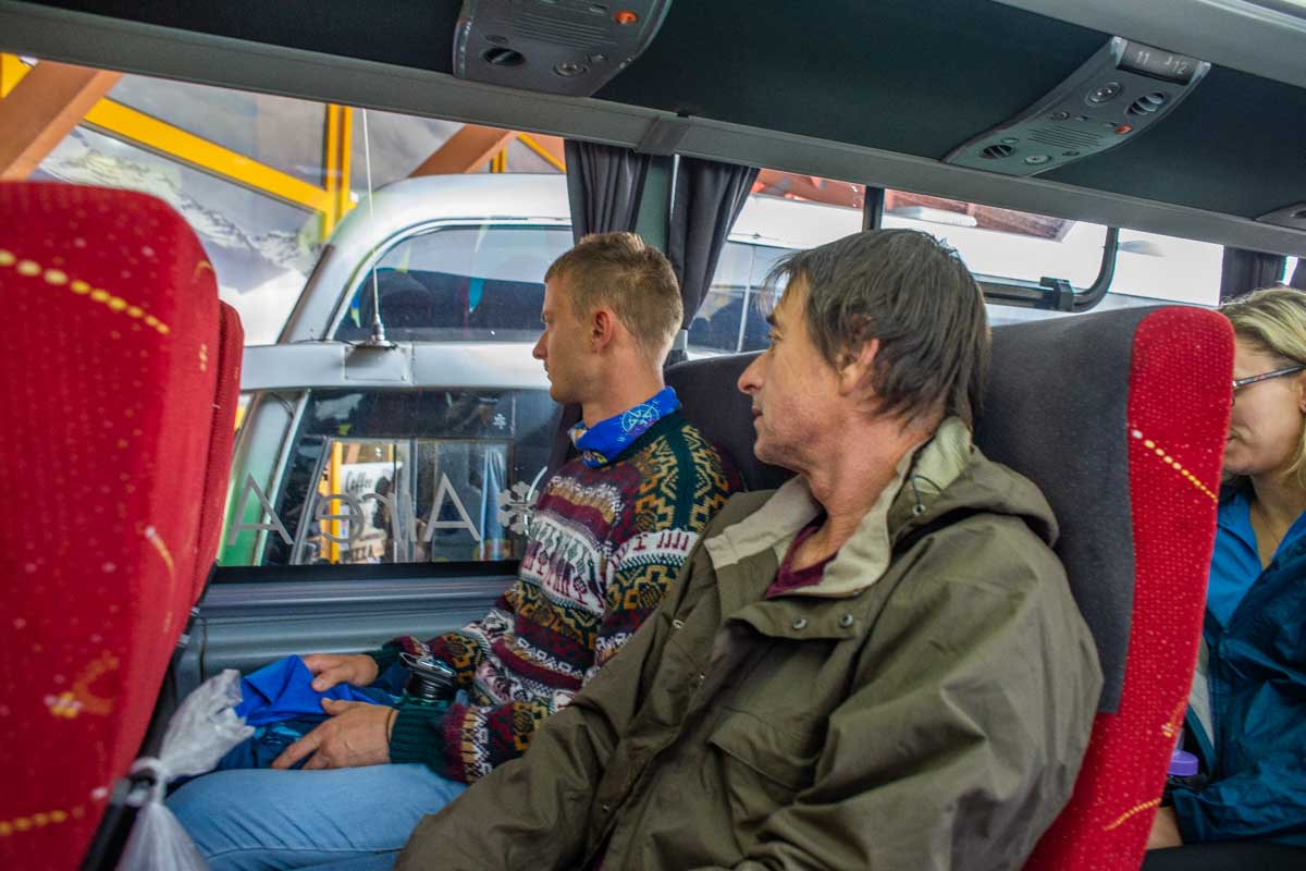 Two people on the bus from Puerto Natales to Torres del Paine National Park, Chile