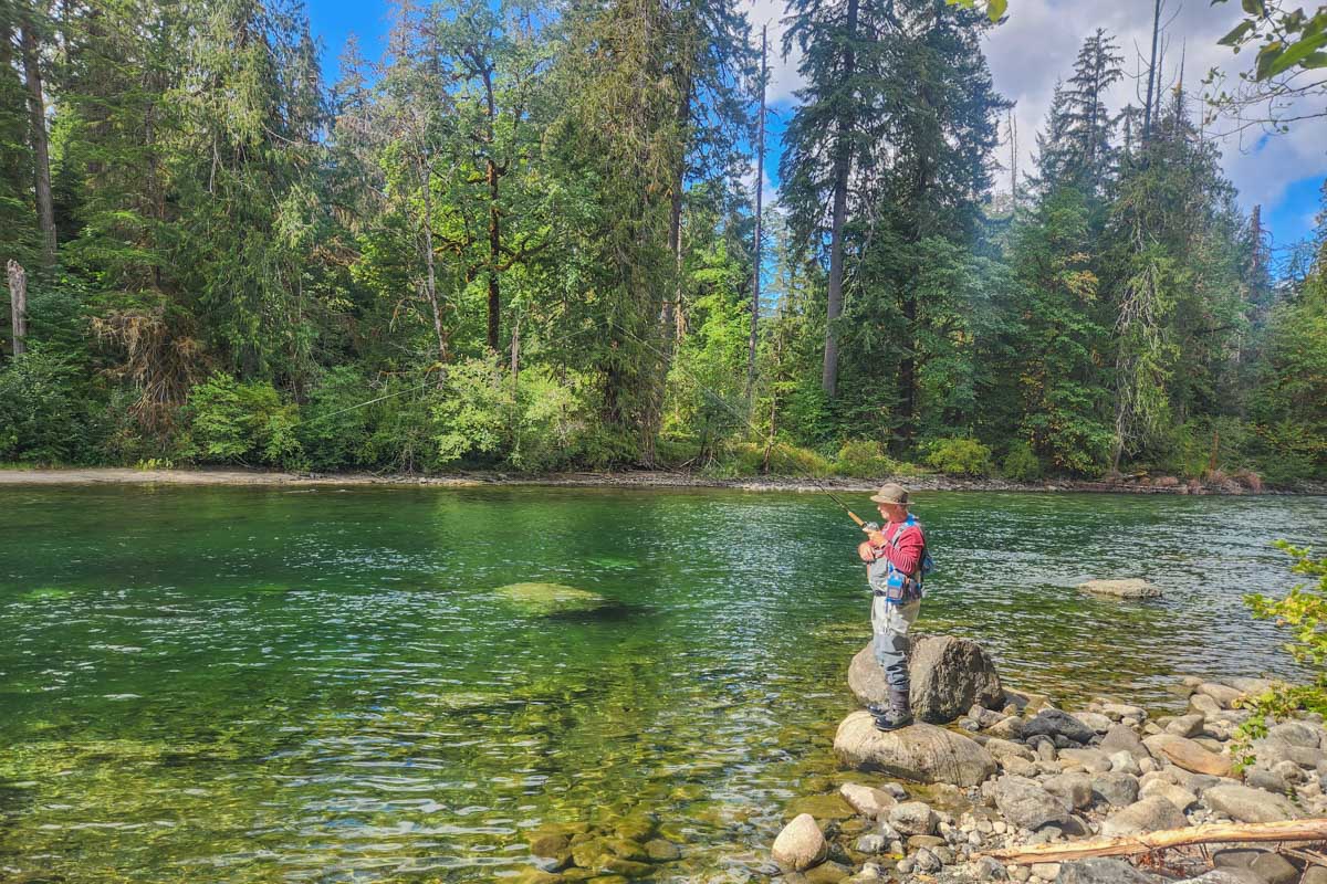 A man fishing in Stamp River Provincial Park