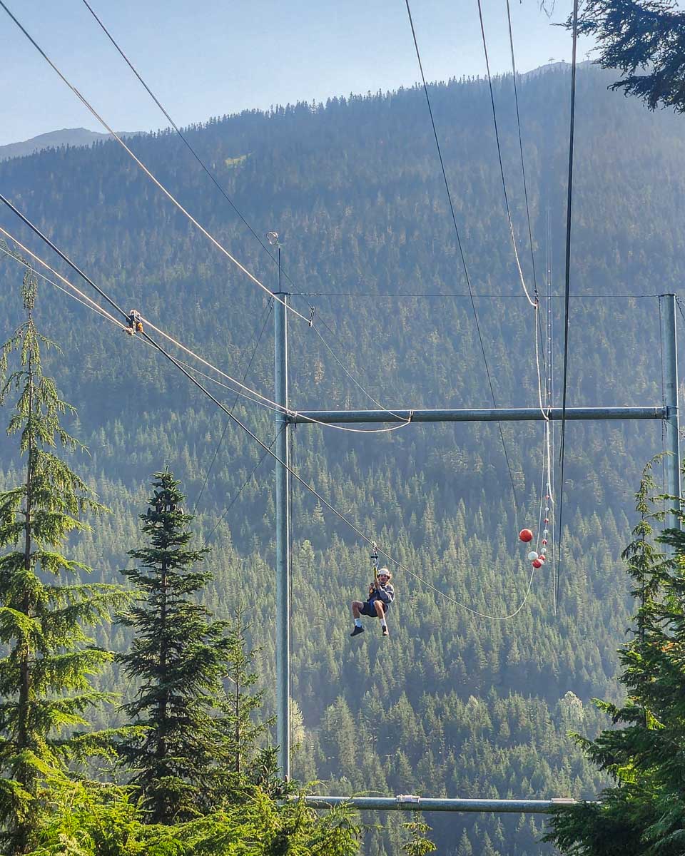 A person zooms towards the end of the  Sasquatch zip line in Whistler, BC