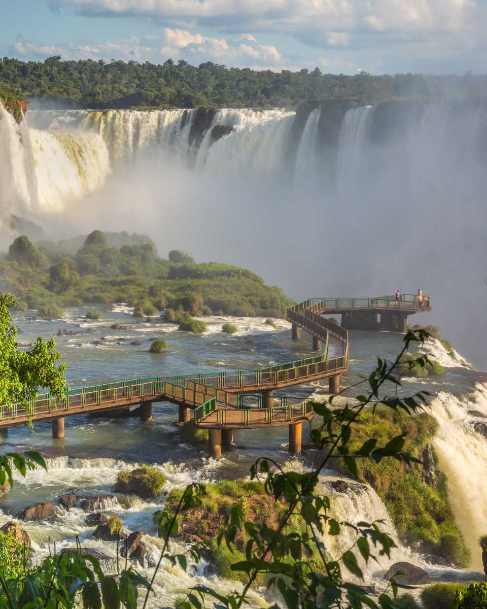A platform leads to the edge of a waterfall at Iguazu Falls