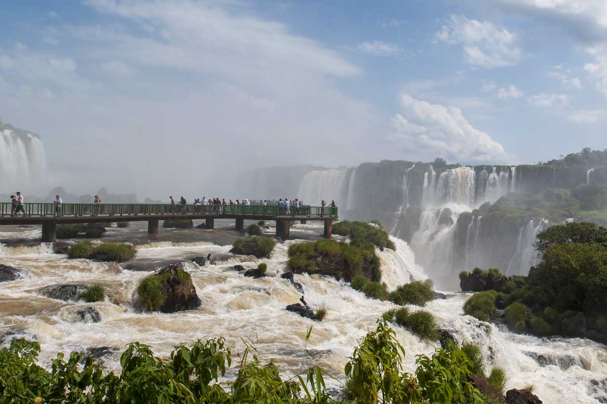 A platform on the Brazil side of Iguazu Falls leads into the middle of the waterfalls