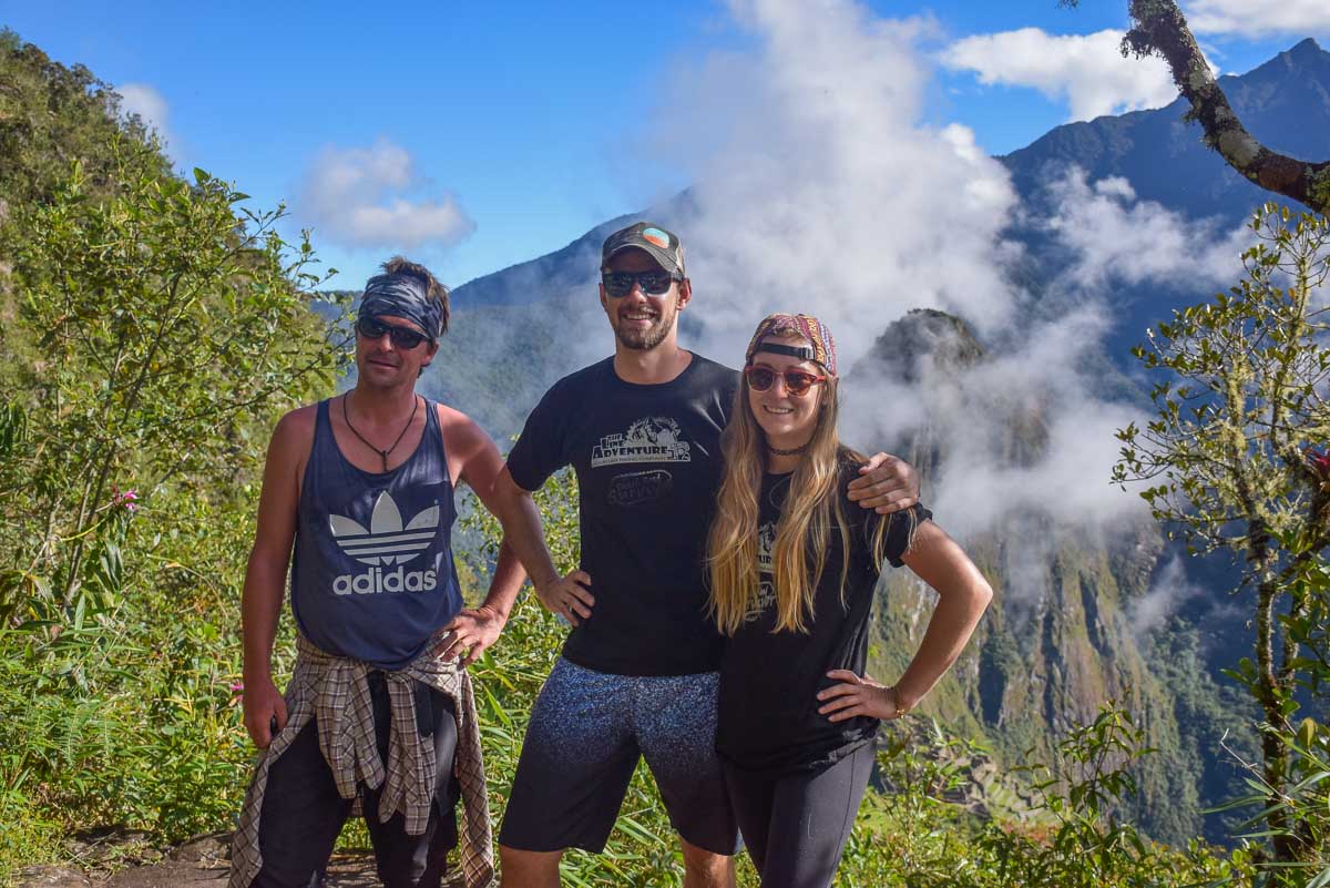 Bailey, Daniel and a friend take a photo on Machu Picchu Mountain