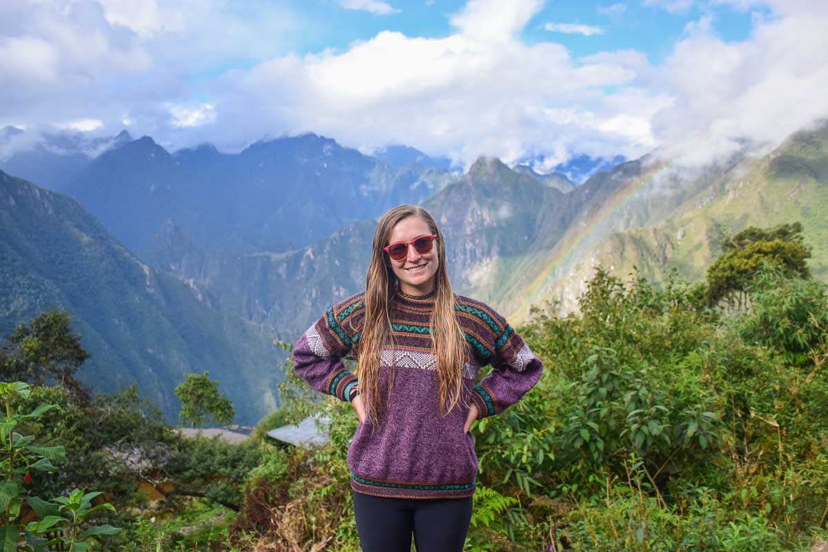 Bailey on the Salkantay Trek with views of Machu Picchu behind her