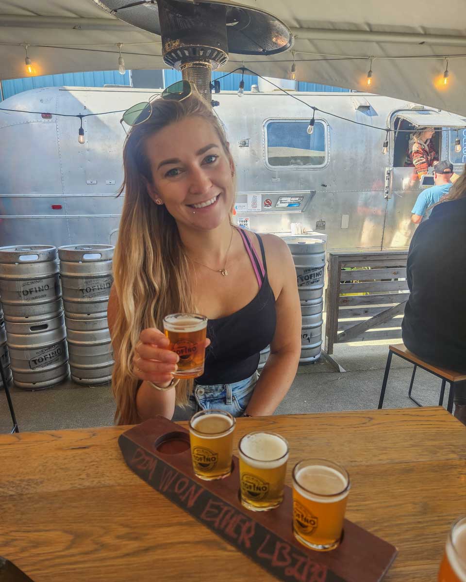 Bailey with a tasting flight at Tofino Brewing