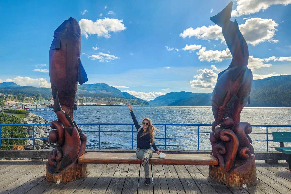 Bailey with the totems at rbor Quay in Port Alberni, BC