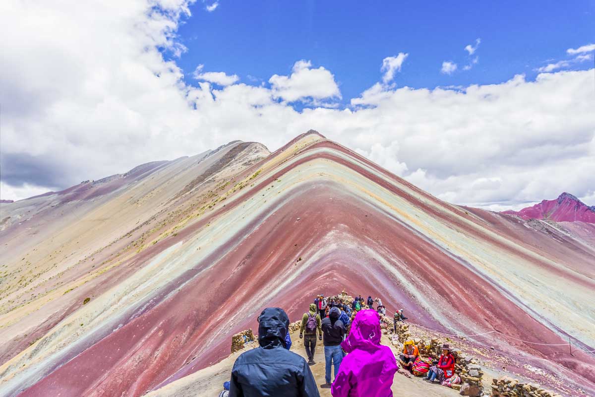 Daniel and Bailey look over Rainbow Mountain in Peru