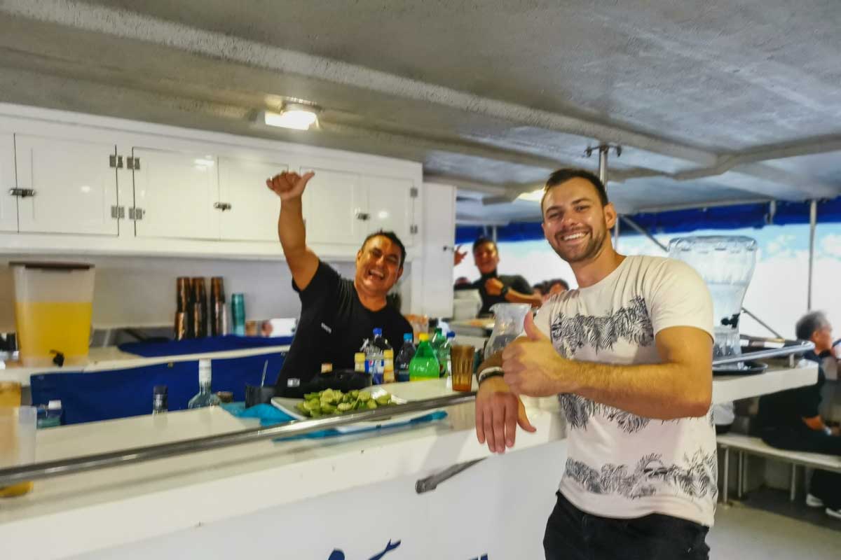 Daniel at the bar with the bartender on the boat to the Rhythms of the Night show in Puerto Vallarta, Mexico